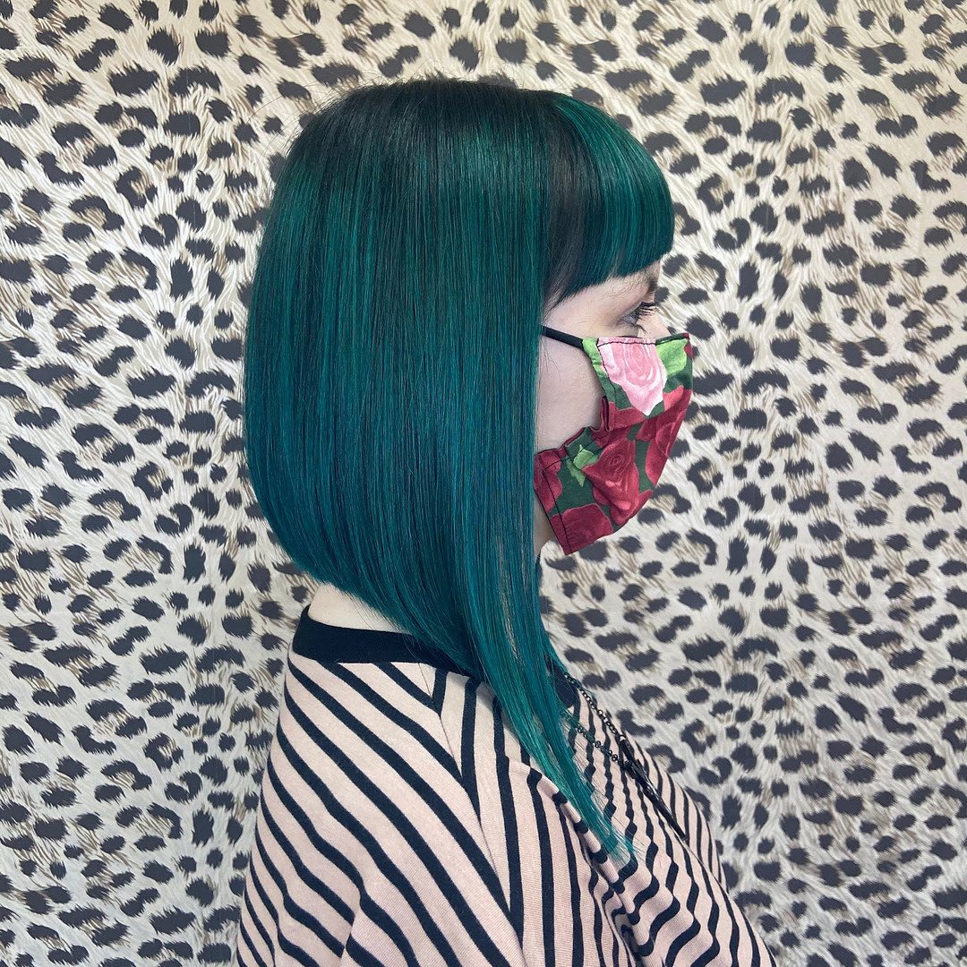 angled long bob cut with bangs