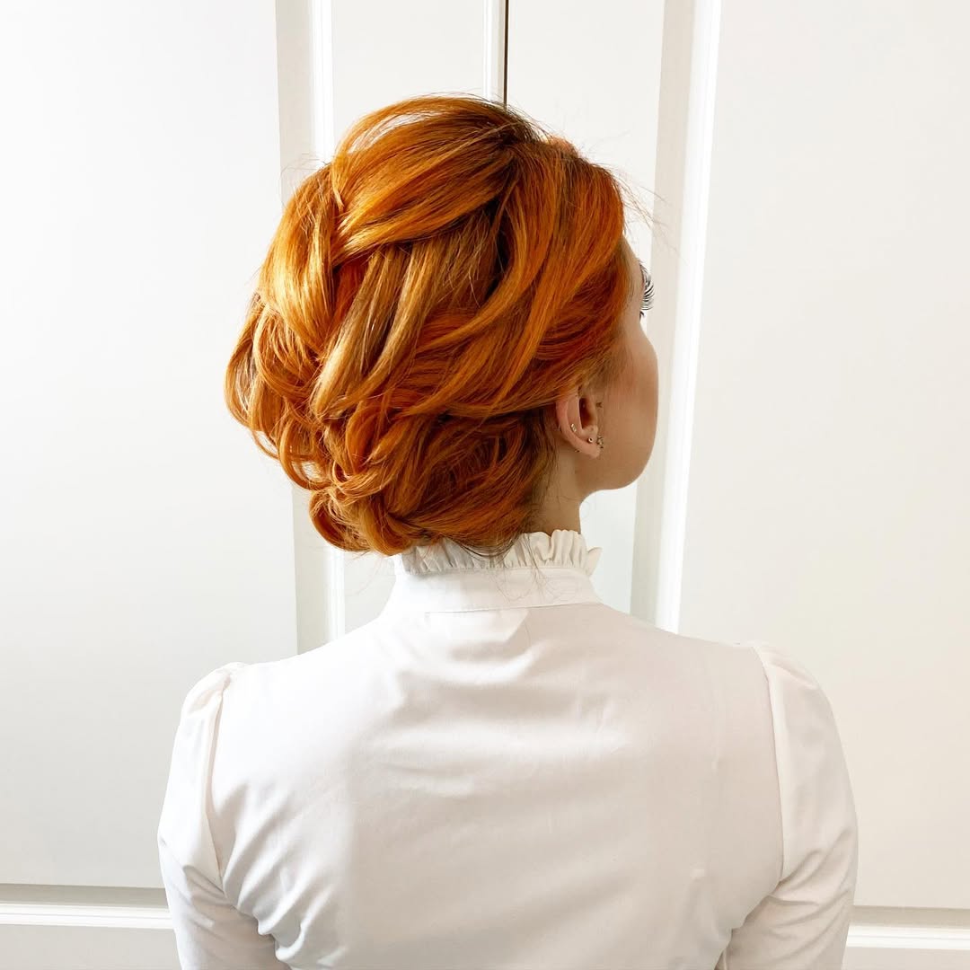 copper orange loose braided updo
