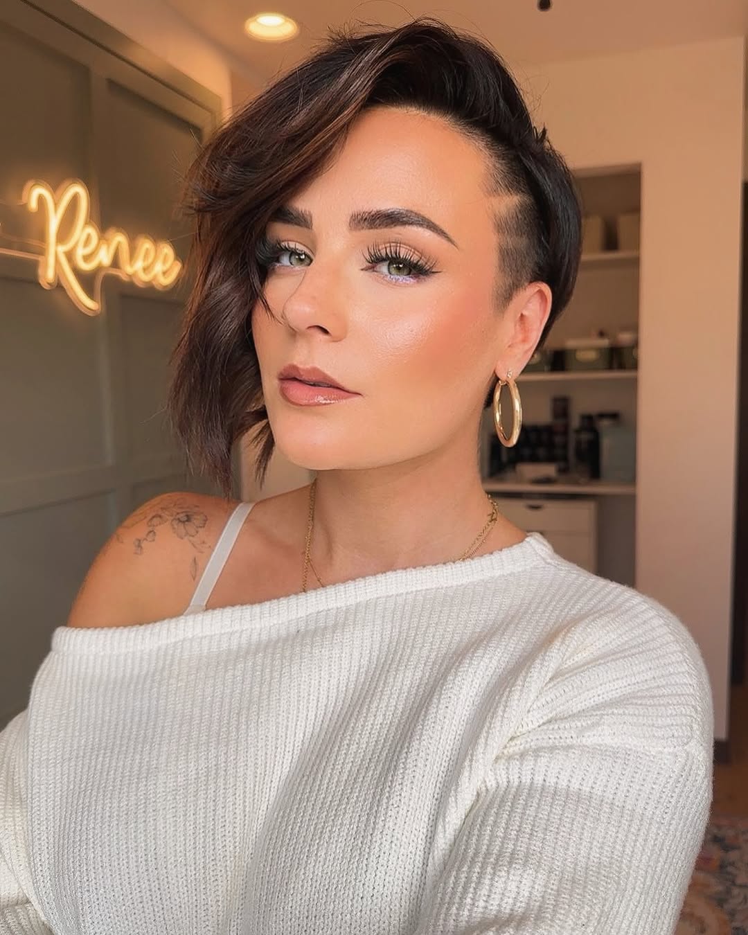 side-parted long pixie cut with an undercut