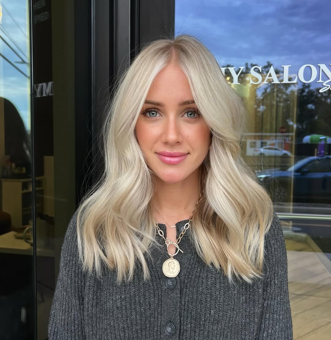 bright blonde hair with face-framing layers