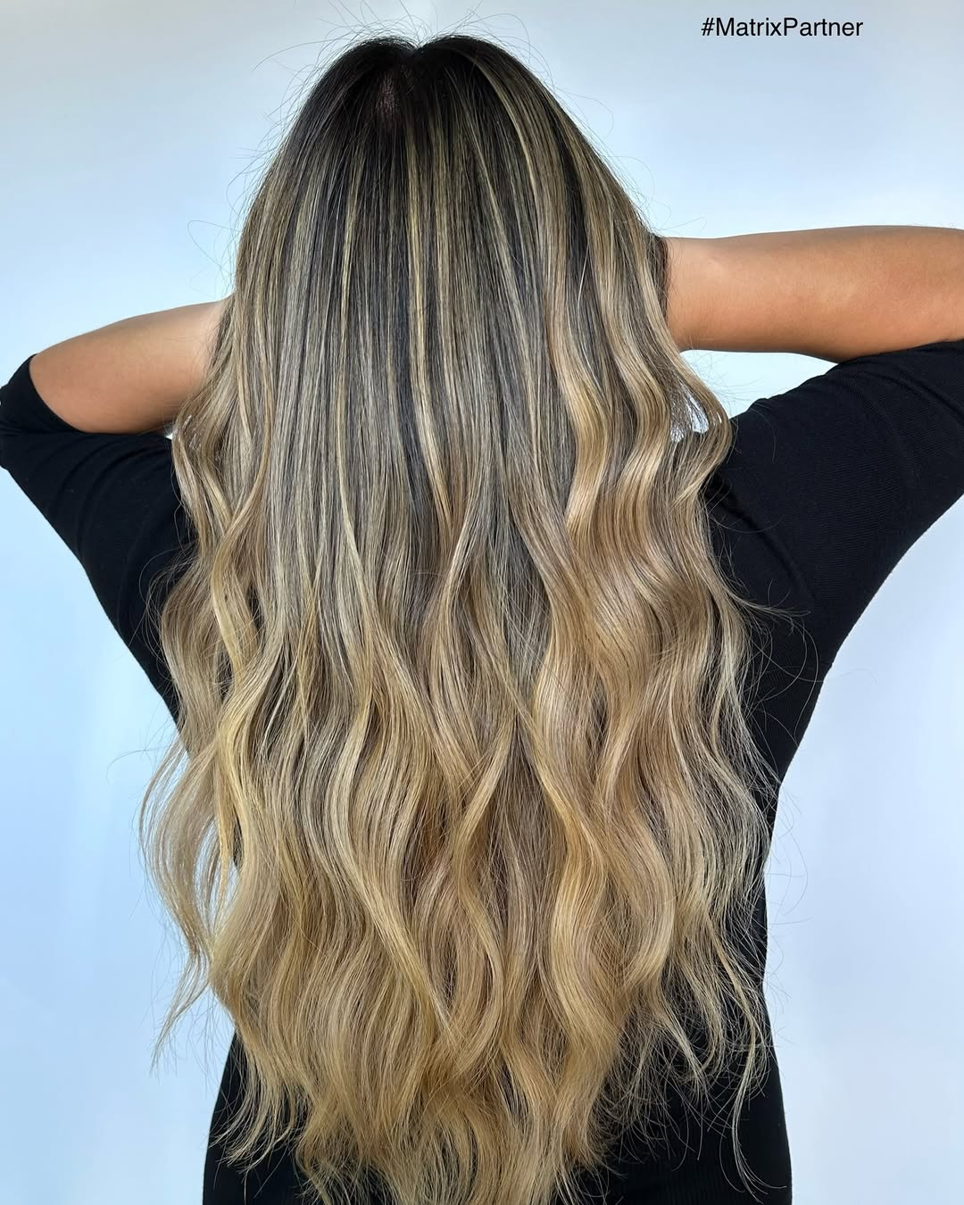 creamy honey blonde balayage with soft waves