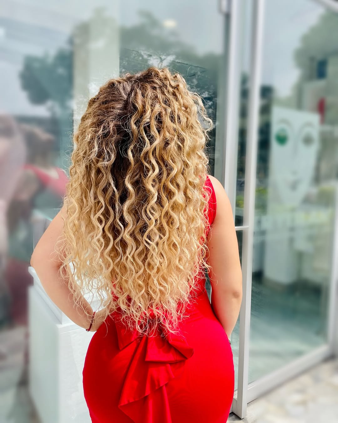 honey blonde balayage on long curly hair