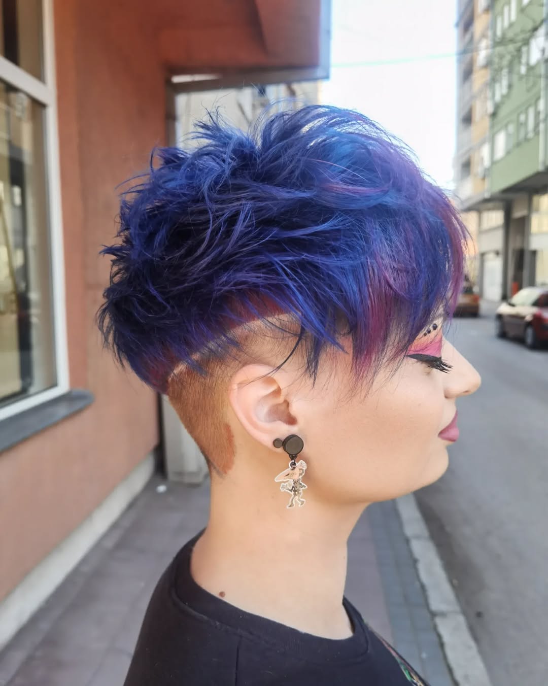 funky colored pixie cut with a nape undercut