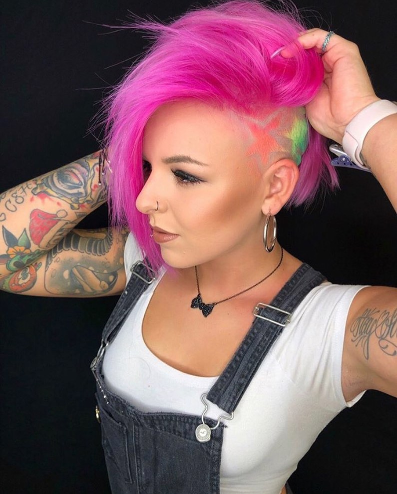 vivid pink funky pixie cut with an undercut