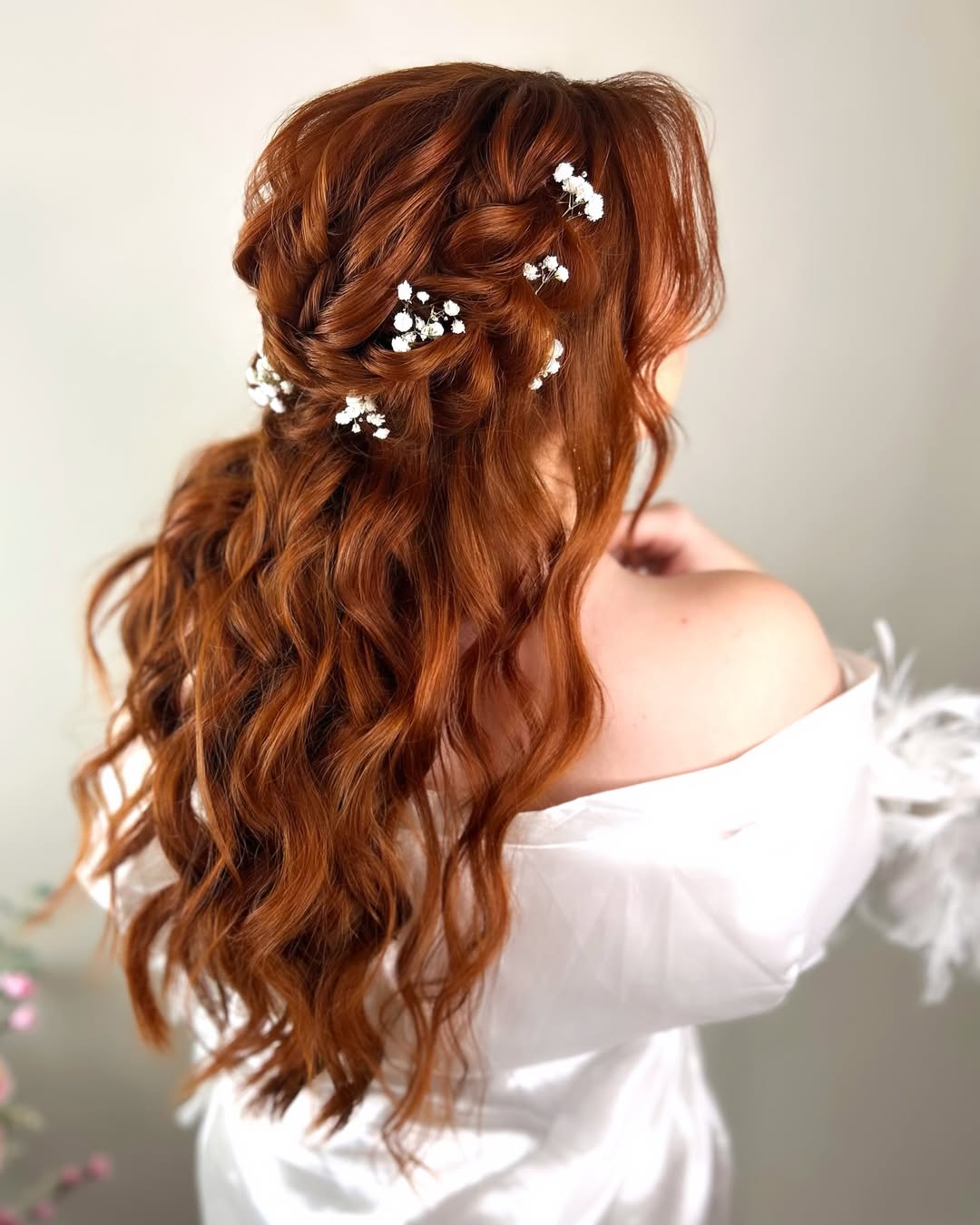 braided half updo with flowers