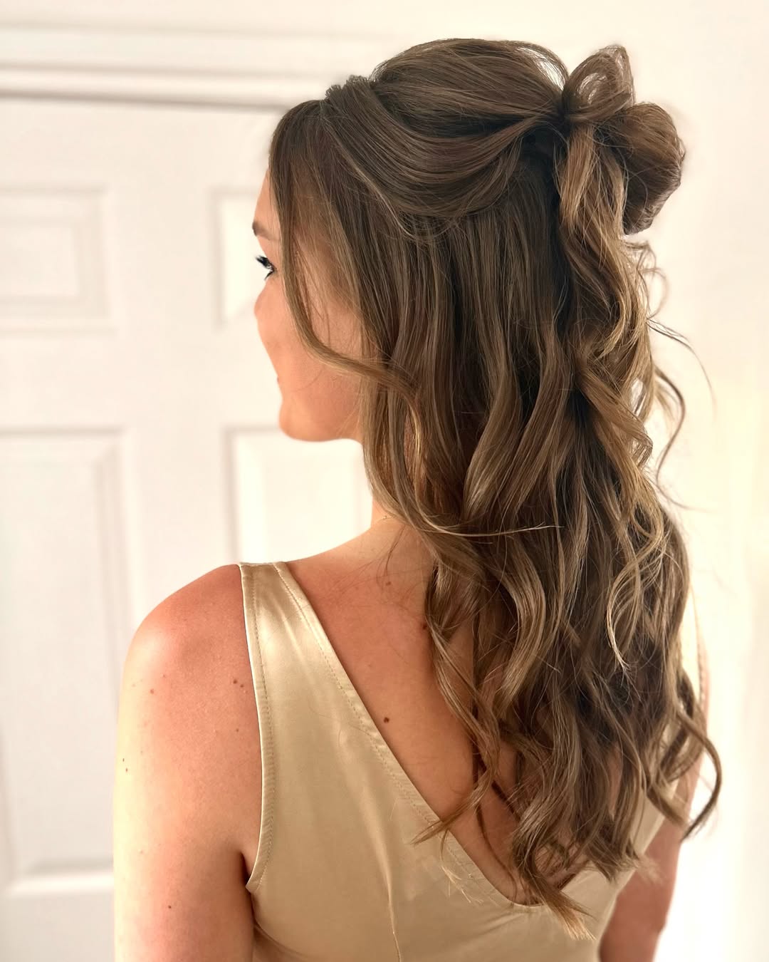 half up messy bun style