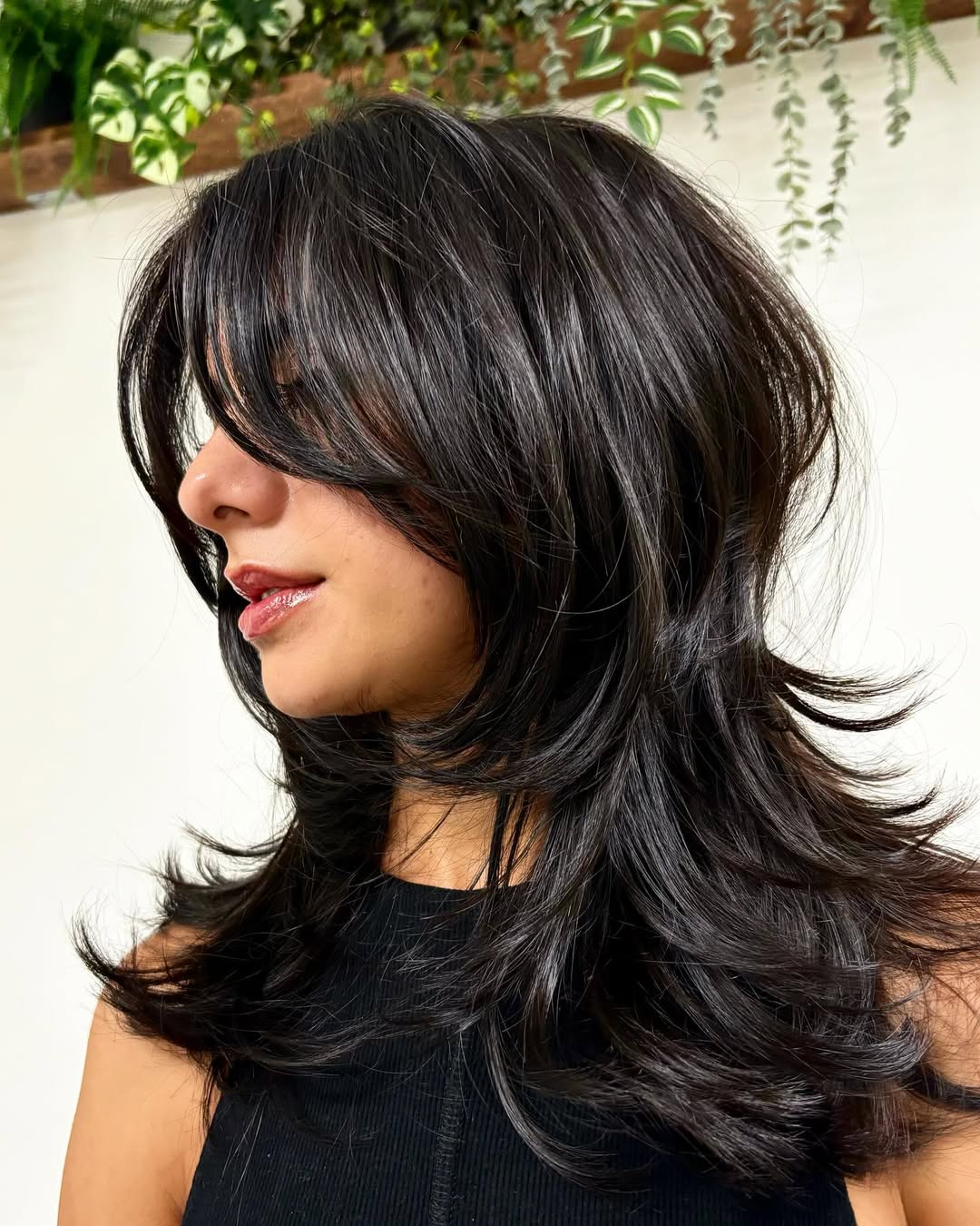 medium length hair with layers and curtain bangs