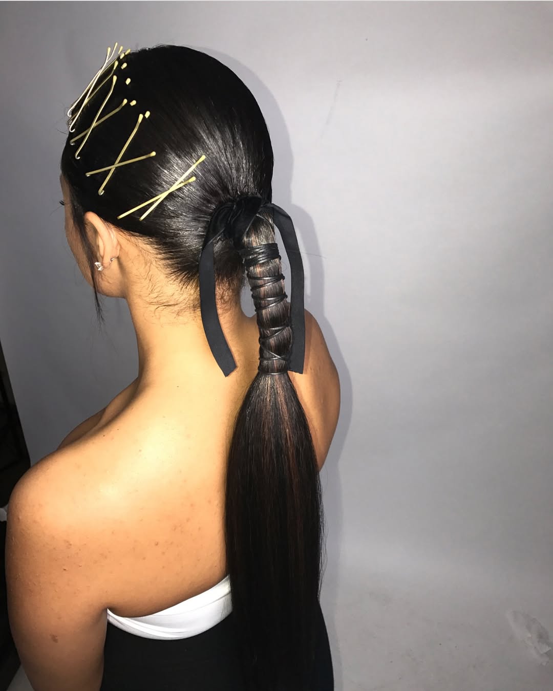 sleek ponytail with a bow