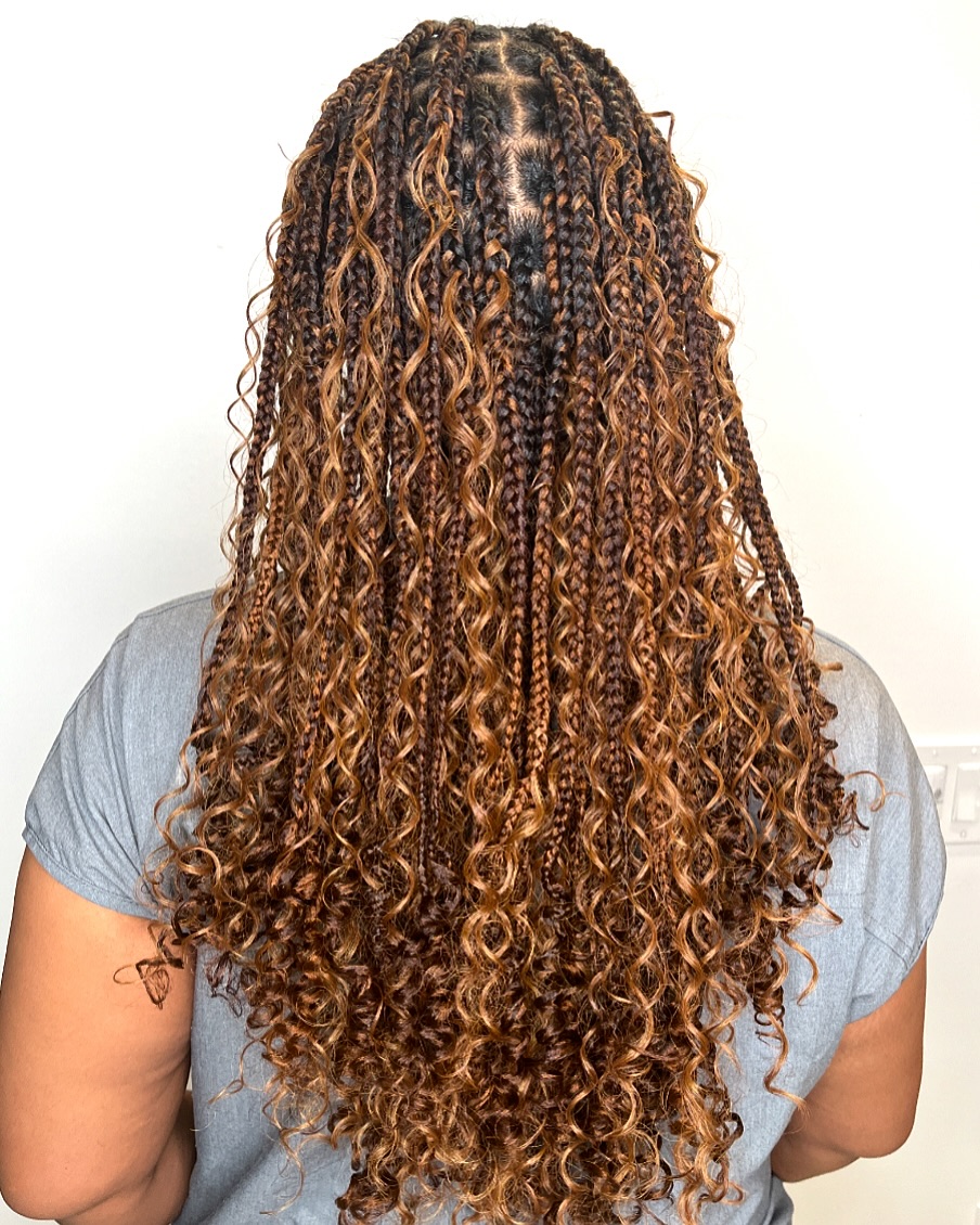 V-shaped boho knotless braids with curls