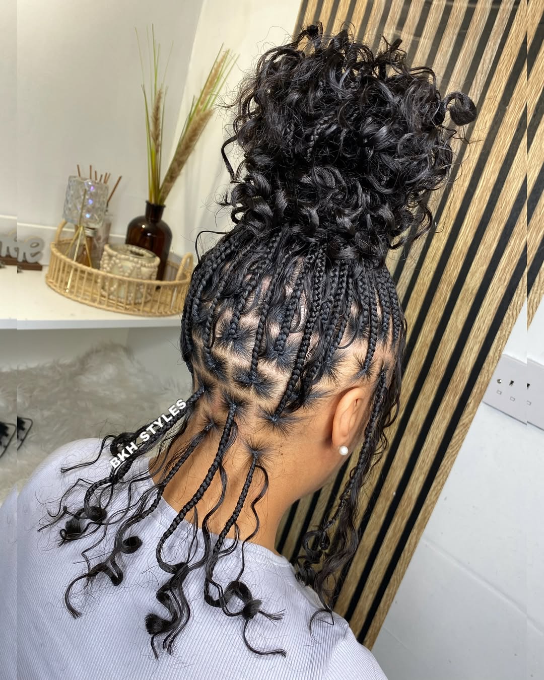 knotless bohemian braids into a massive bun