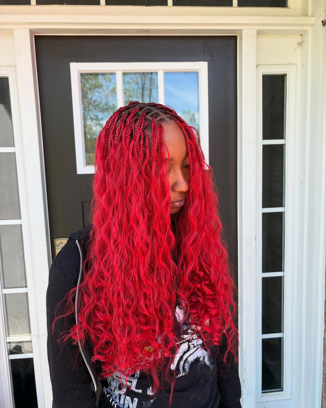 red knotless box braids with curly ends