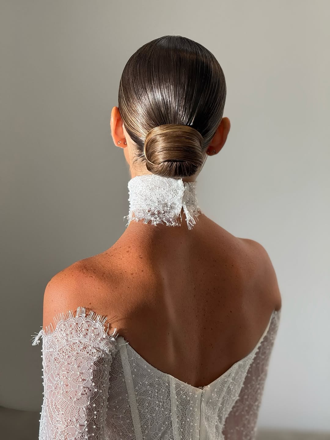 slicked-back bun