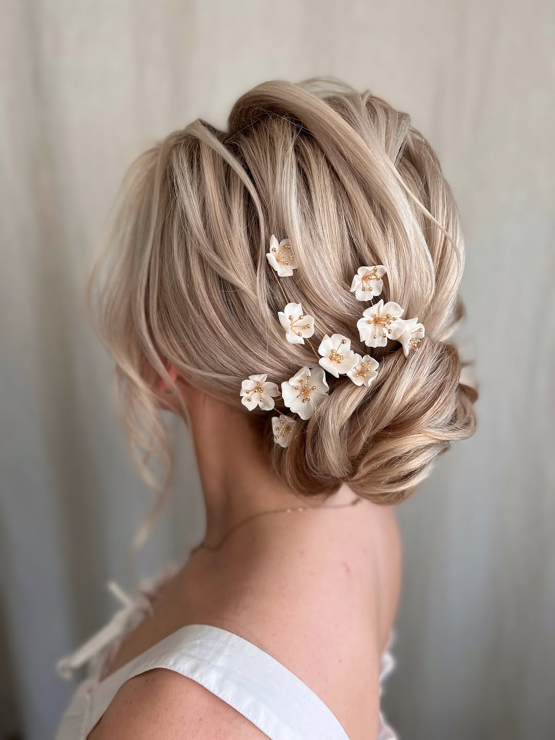 bridal bun updo with flowers