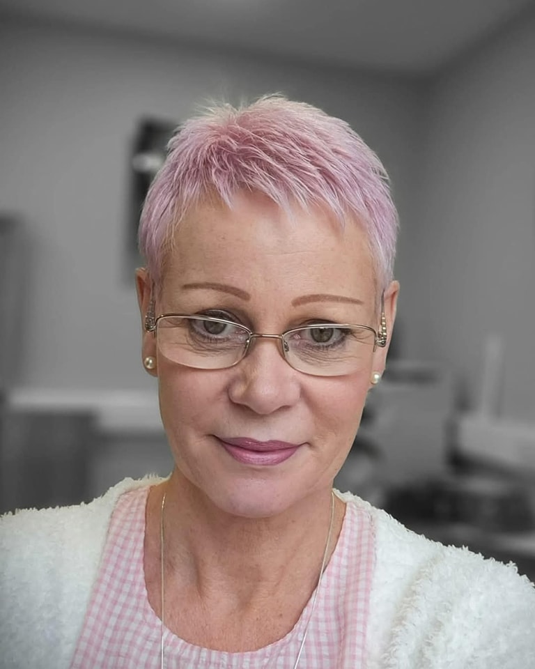 pastel pink pixie haircut for older women