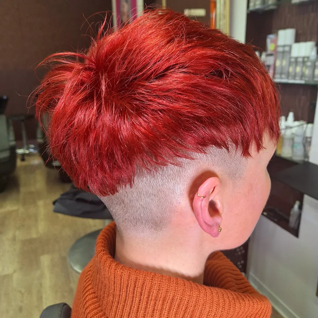 red edgy pixie cut with shaved sides